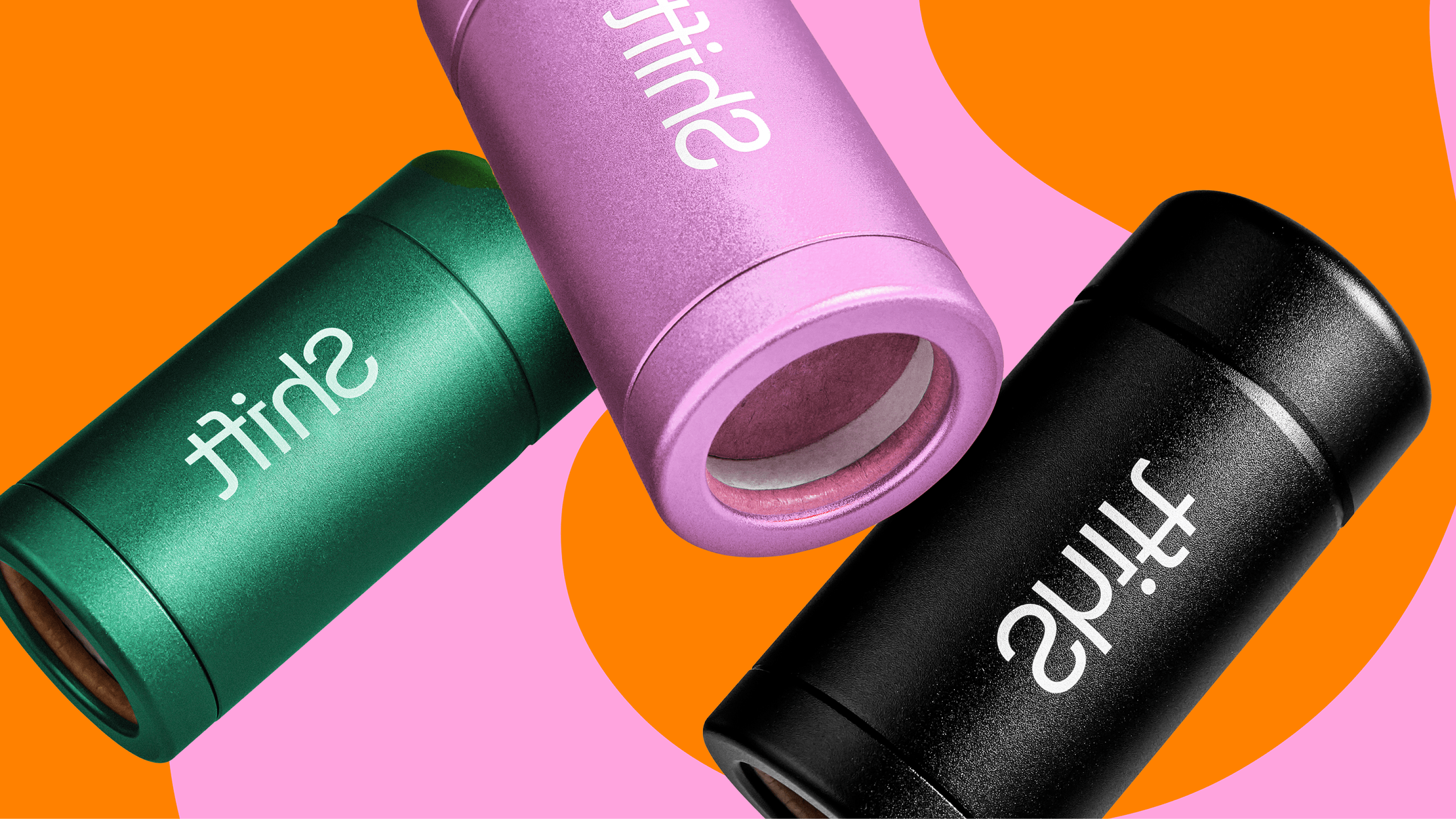 Three metal deodorant containers in black, pink and green, with a pink and orange background with the name &#34;shift&#34; on them